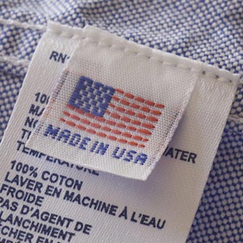 T-shirt tag with an american flag that says Made in the USA